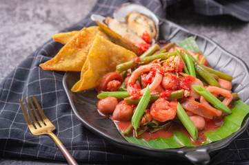 pink spicy seafood noodle Fried noodle with sea food and kale in gravy , Thai Food