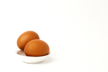 Fresh raw eggs on white background