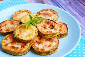 Tasty grilled zucchini on plate, closeup.