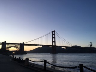 Golden Gate Bridge romantic sunset with blue sky