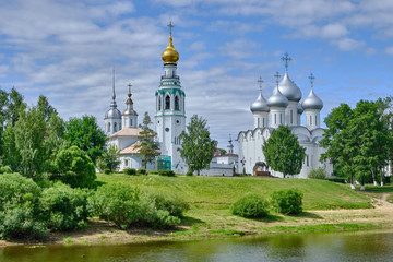 Fototapeta na wymiar Scenic view of old kremlin in ancient touristic town Vologda in Russian Federation. Beautiful summer sunny look of ancient orthodox temple in fortress in urban area of capital of russian province