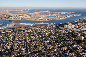 Afternoon aerial view of San Pedro area streets, homes and harbor waterfront facilities in Los Angeles County California.  