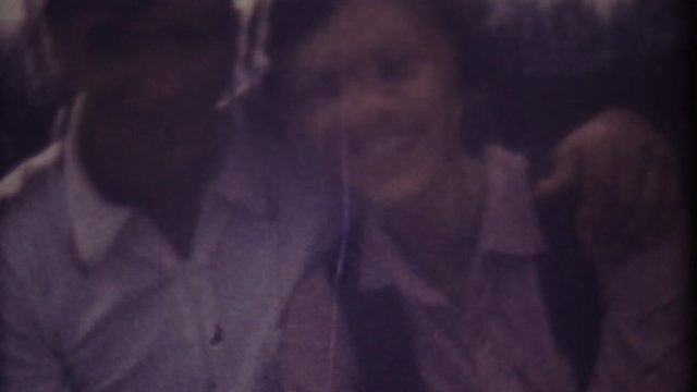 Family chronicle, memories: Happy young loving couple. My love parents. My beauty family. Shot on 8 mm retro camera.