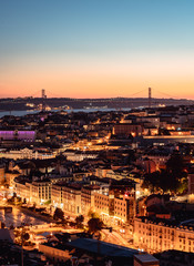 Fototapeta na wymiar Panorama of Cityscape of illuminated Lisbon (Lisboa) Portugal, from a viewpoint, after summer sunset against sky.