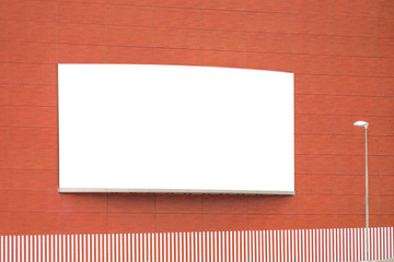 Mock up template. Big blank billboard outdoors, outdoor advertising board on red building wall