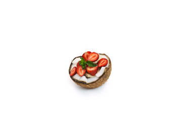 coconut cut with banana and strawberry slices with mint on white background