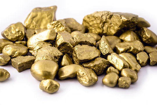 gold nuggets on white background isolated. High resolution photo of gold stones. Concept of luxury and wealth.