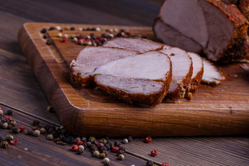 veal roll on wooden board