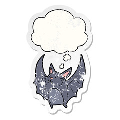 cartoon halloween bat and thought bubble as a distressed worn sticker