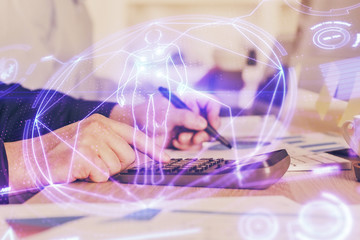 Man's hands working with notes background. Modern computer record diagram with virtual mnitor.