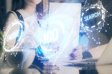 Cryptocurrency hologram over woman's hands writing background. Concept of blockchain. Double...
