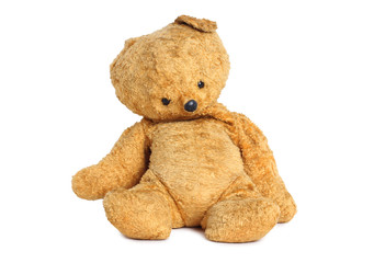 Old teddy bear on white background