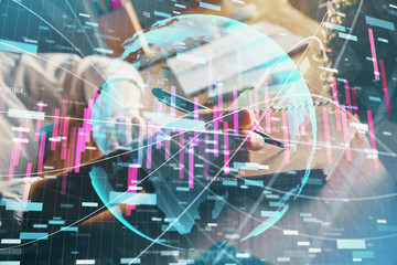 Financial forex charts displayed on woman's hand taking notes background. Concept of research. Double exposure