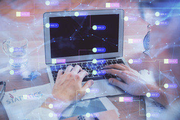 Businessman with computer background with technology theme hologram. Concept of big data. Double exposure.