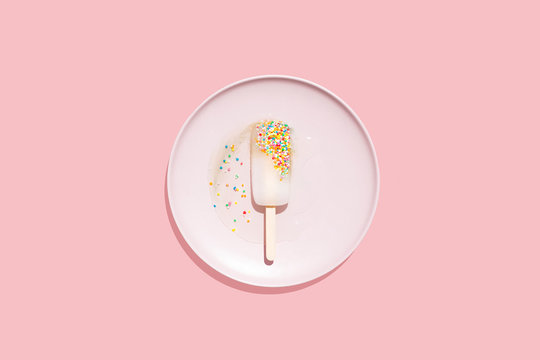 Melting Popsicle on Pink Background, Isolated with Copy Space 