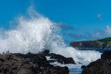 waves crashing on coast rocks