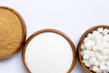 Various types of sugar on white background.