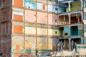 Partially destroyed industrial building with colored walls