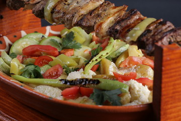 Lunch, meat, beef and salade onion, tomato pepper, potato,cheese, cucumbers, traditional.