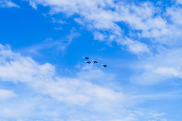 group of planes in the blue sky
