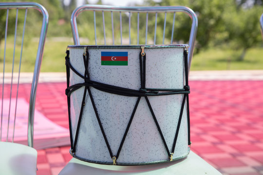 Azeri traditional drum nagara on black .White Drum on the chair