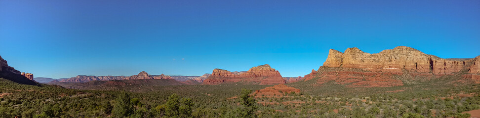 Fototapeta na wymiar Panoramic View of landscape against blue sky in Sedona Arizona