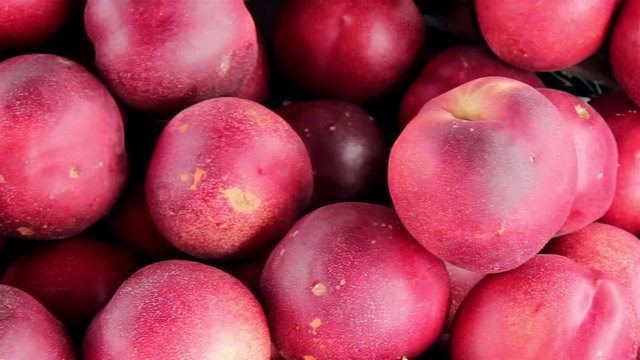 many fresh red peaches on the market