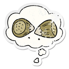 cartoon hazelnuts and thought bubble as a distressed worn sticker