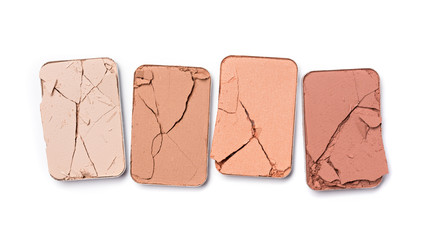 Pink, beige and coral color of crushed eye shadow for makeup