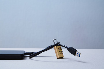 Computer or internet security. Data protection concept: external hard drive and lock