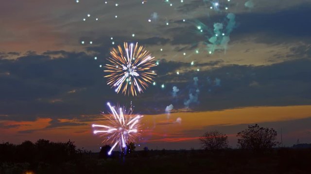 Beautiful sunset and colorful highlights fireworks after sunset Salute is in the sky