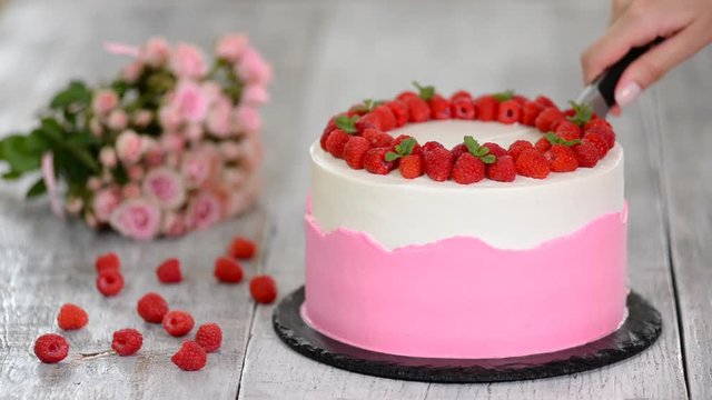 Delicious raspberry cake with fresh raspberries and mint.