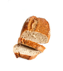Loaf of whole wheat bread with slices isolated on white background