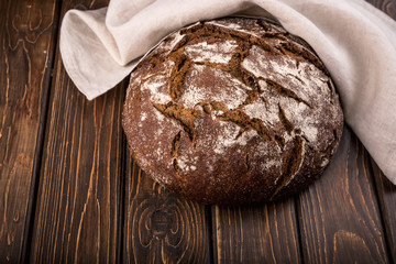 round rye bread with cracks