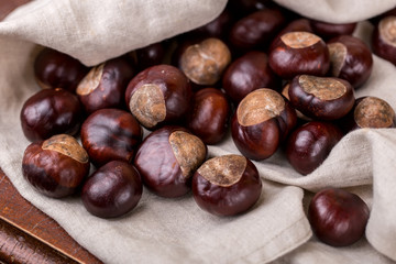 chestnuts on wooden background