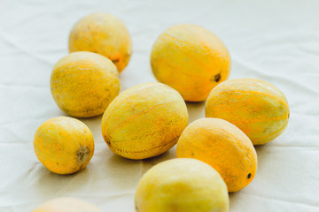 A group of bright orange melon berries.