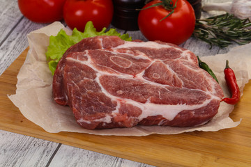 Raw pork neck steak