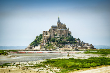 Mont Saint Michel, France - June 28, 2012. Famous historic cathedral at low tide 