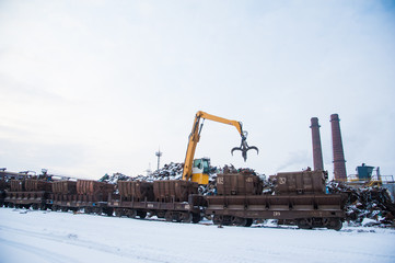 Crane-loading scrap in a train