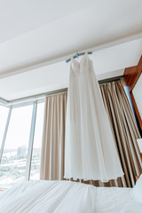 Wedding white dress in a light interior