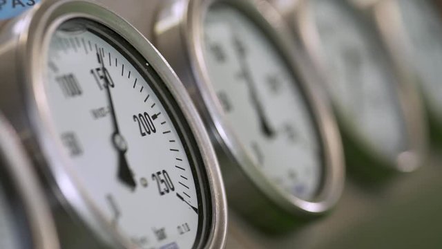 Pressure clocks inside metalworking factory.