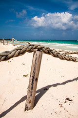 POST AND SOGA PROTECTION IN THE SAND OF THE BEACH IN THE DOMINICAN CARIBBEAN