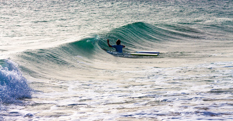 URF IN THE WAVES OF THE BEACHES OF CADIZ IN SPAIN