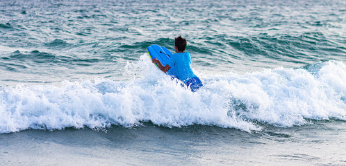 URF IN THE WAVES OF THE BEACHES OF CADIZ IN SPAIN