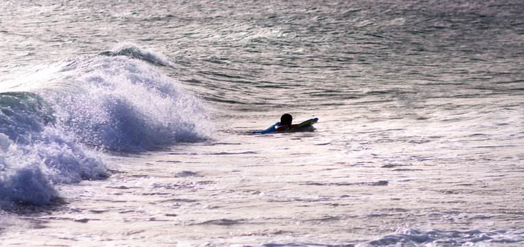 URF IN THE WAVES OF THE BEACHES OF CADIZ IN SPAIN