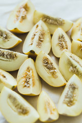 A group of brightly lit melon slices.