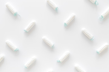 Gynaecologist and menstruation concept with tampons pattern on white background top view