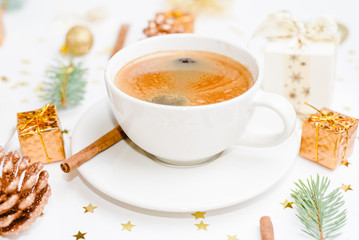 cup of hot coffee on a christmas holiday table. holidays and events consept.