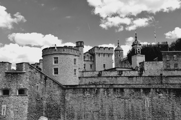 The famous White Tower and the Tower of London from South Bank across the River Thames. Popular historical tourist attraction on a summer day.
