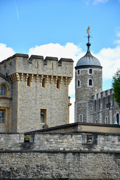 The famous White Tower and the Tower of London from South Bank across the River Thames. Popular historical tourist attraction on a summer day.